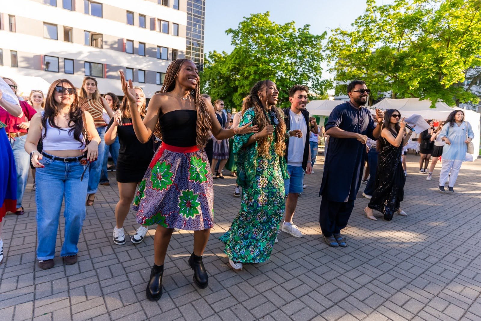 smiling and dancing international students