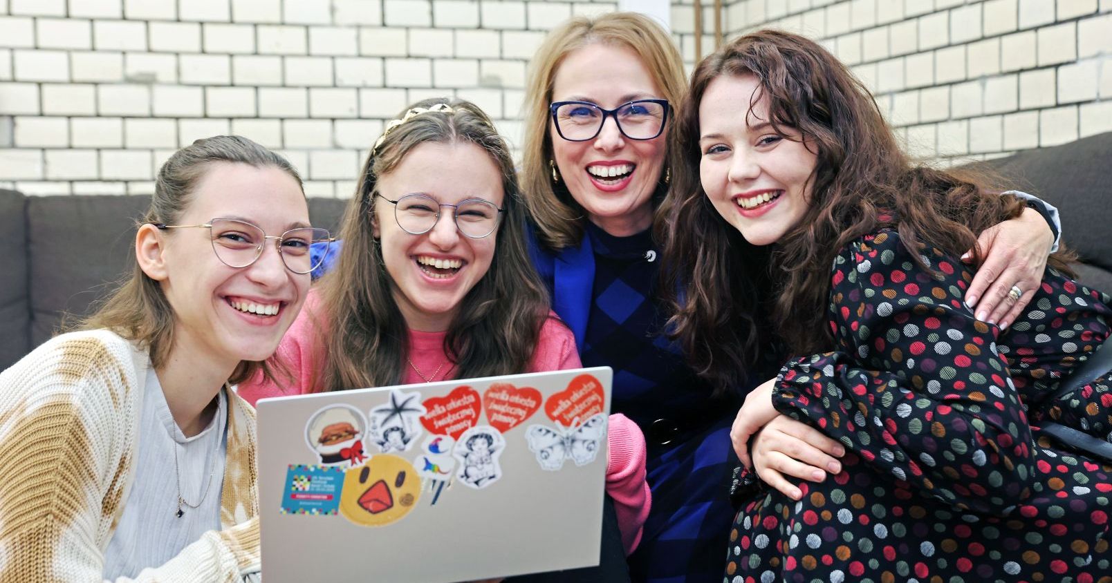 Four smiling female students.