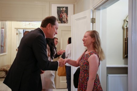 The interior of the ambassador's residence, in the foreground the Ambassador is greeting Alison McIsaac. Click to zoom the picture.