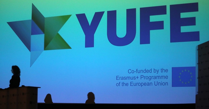 YUFE logo on big screen