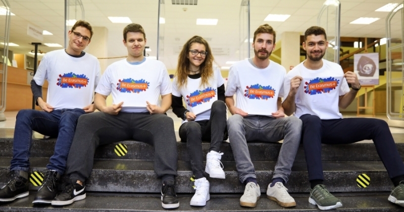 Group of students wearing Erasmus+ t-shirts sitting