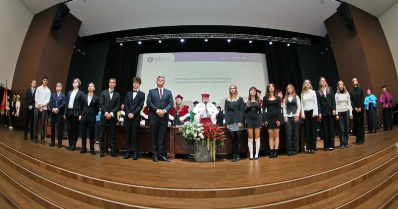 Matriculation ceremony, first-year students standing on the stage